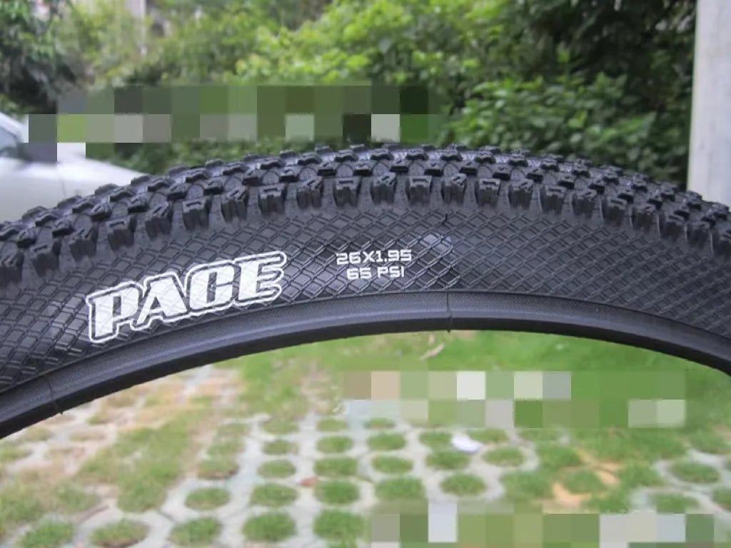 Ultralight mountain bike tyre with black tread, shown in 26, 27.5 and 29 inch sizes