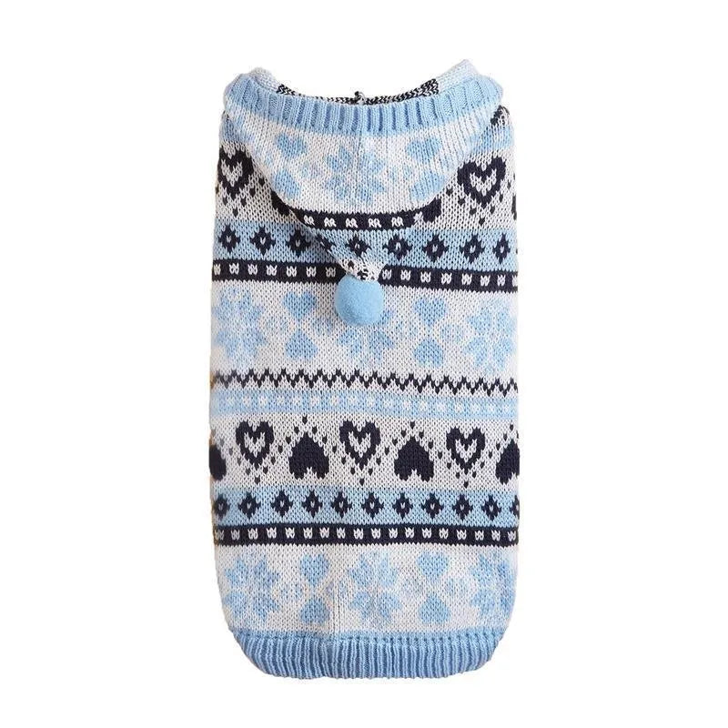 Colourful knitted dog sweater with snowflake and love heart patterns on a striped background.