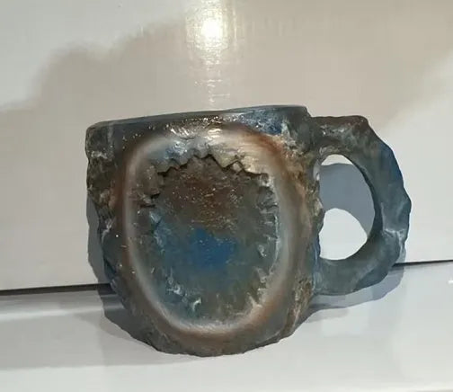 Resin mineral crystal coffee mug with handle in purple colour, showing 3D texture.
