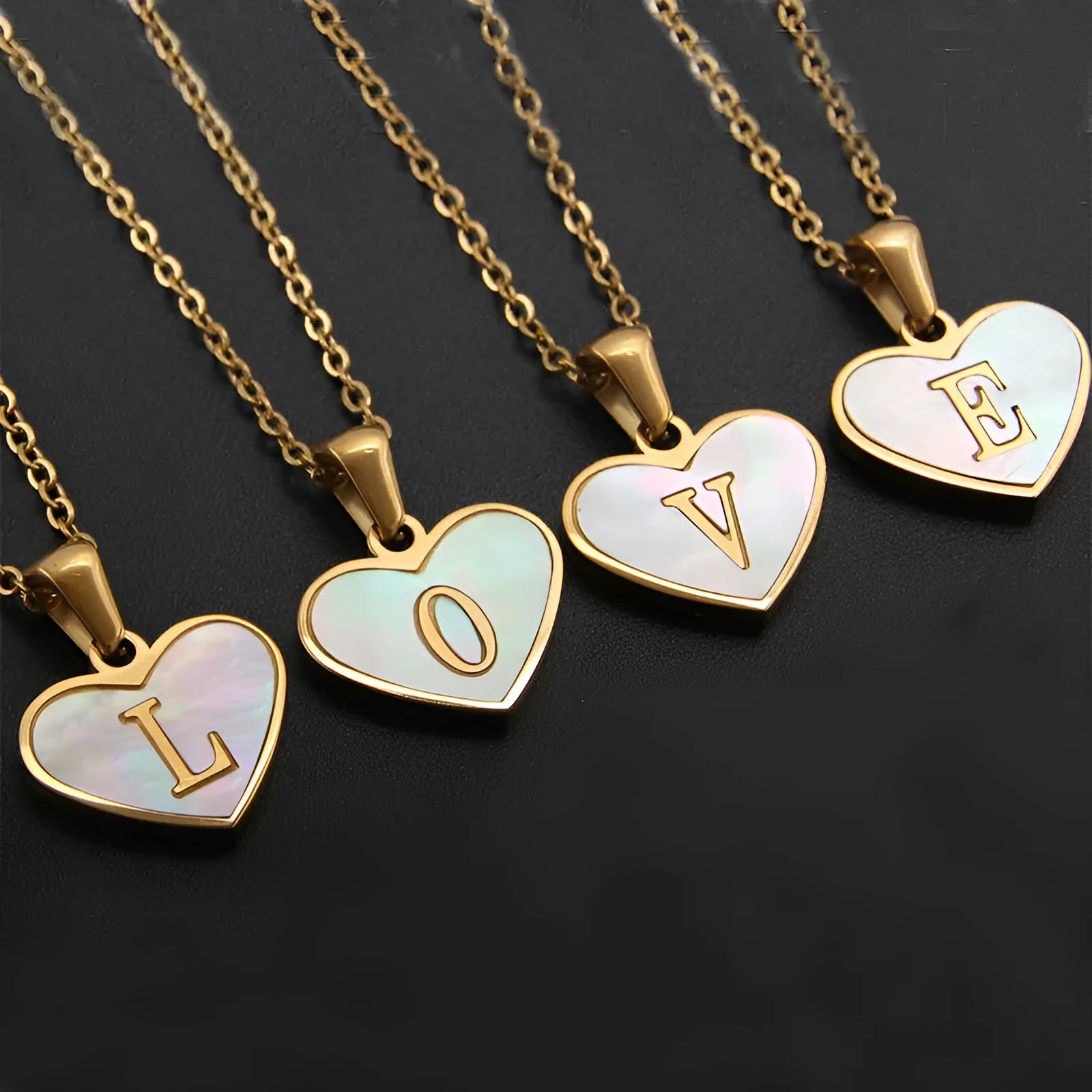 Gold-plated stainless steel necklace with a letter pendant and heart charm on a 45+5cm chain.