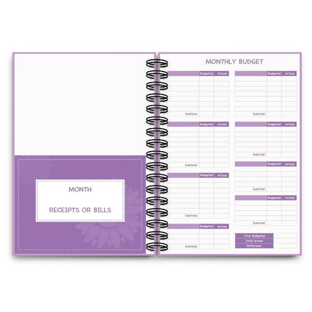 J12 purple coil-bound budget notebook with pen, sticker sheets, and paper clips for financial planning.
