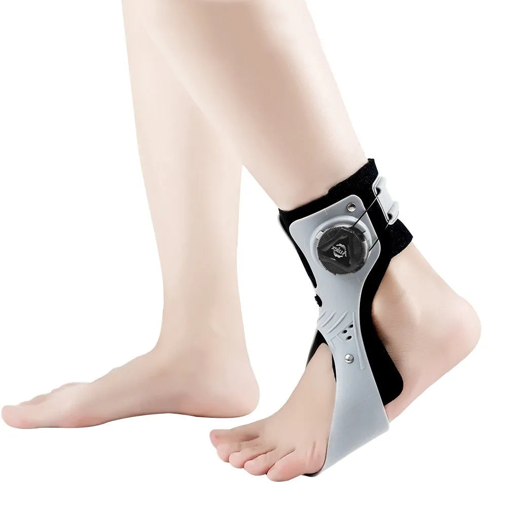Grey ankle support brace with airbag button closure system for left foot