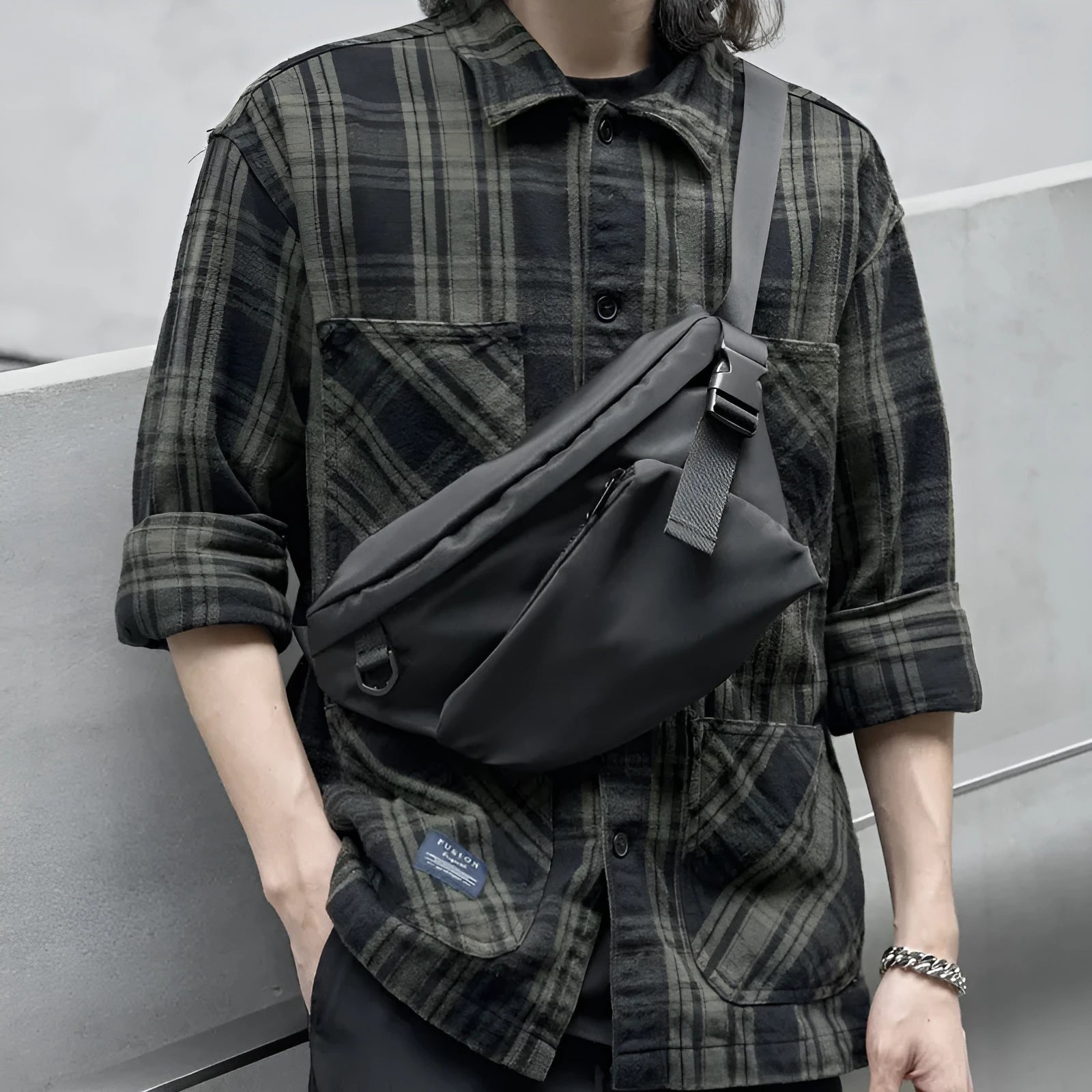 Black men's chest bag with slanted design showing oxford fabric and sewing lines