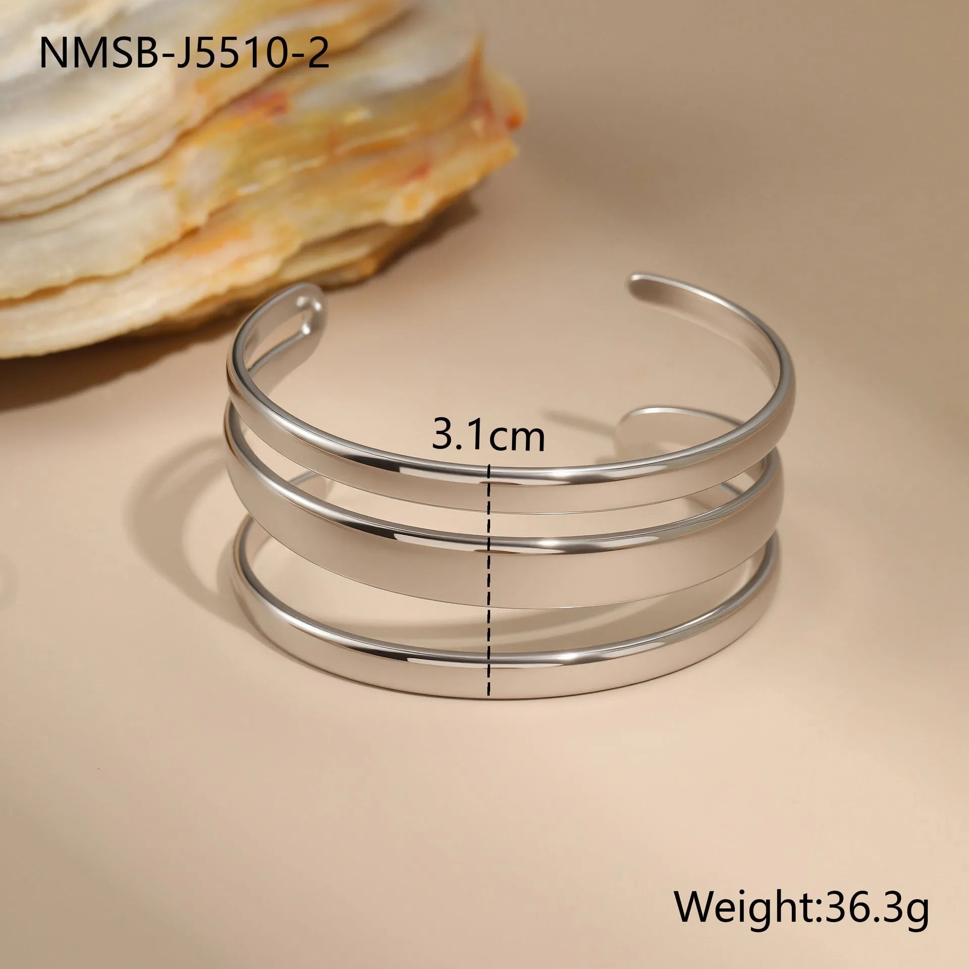 Stainless steel women's bracelet with geometric lines and simple opening clasp in gold or steel finish