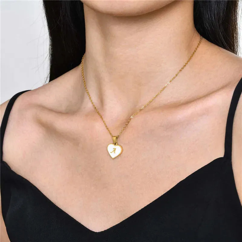 Gold-plated stainless steel necklace with a letter pendant and heart charm on a 45+5cm chain.