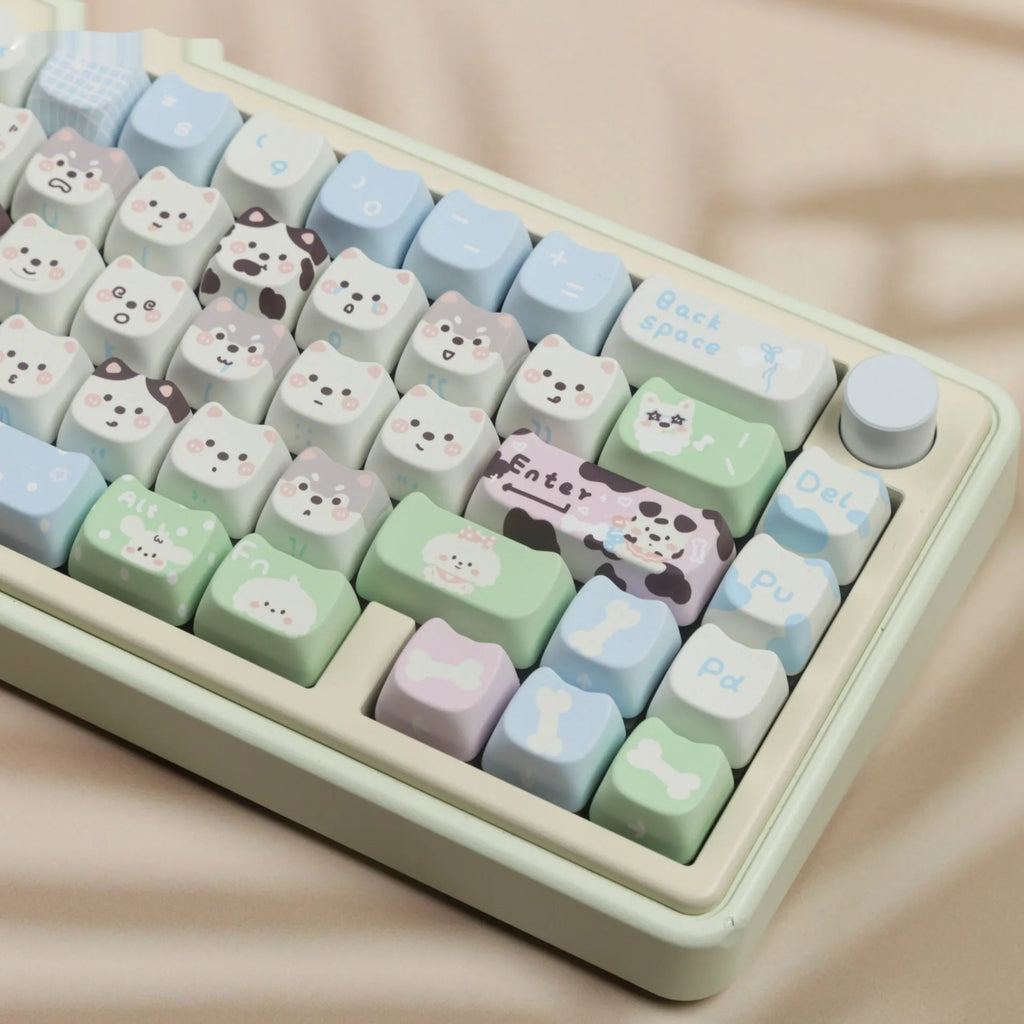 PBT sublimation keycap set showing detailed puppy and cat designs on mechanical keyboard keys