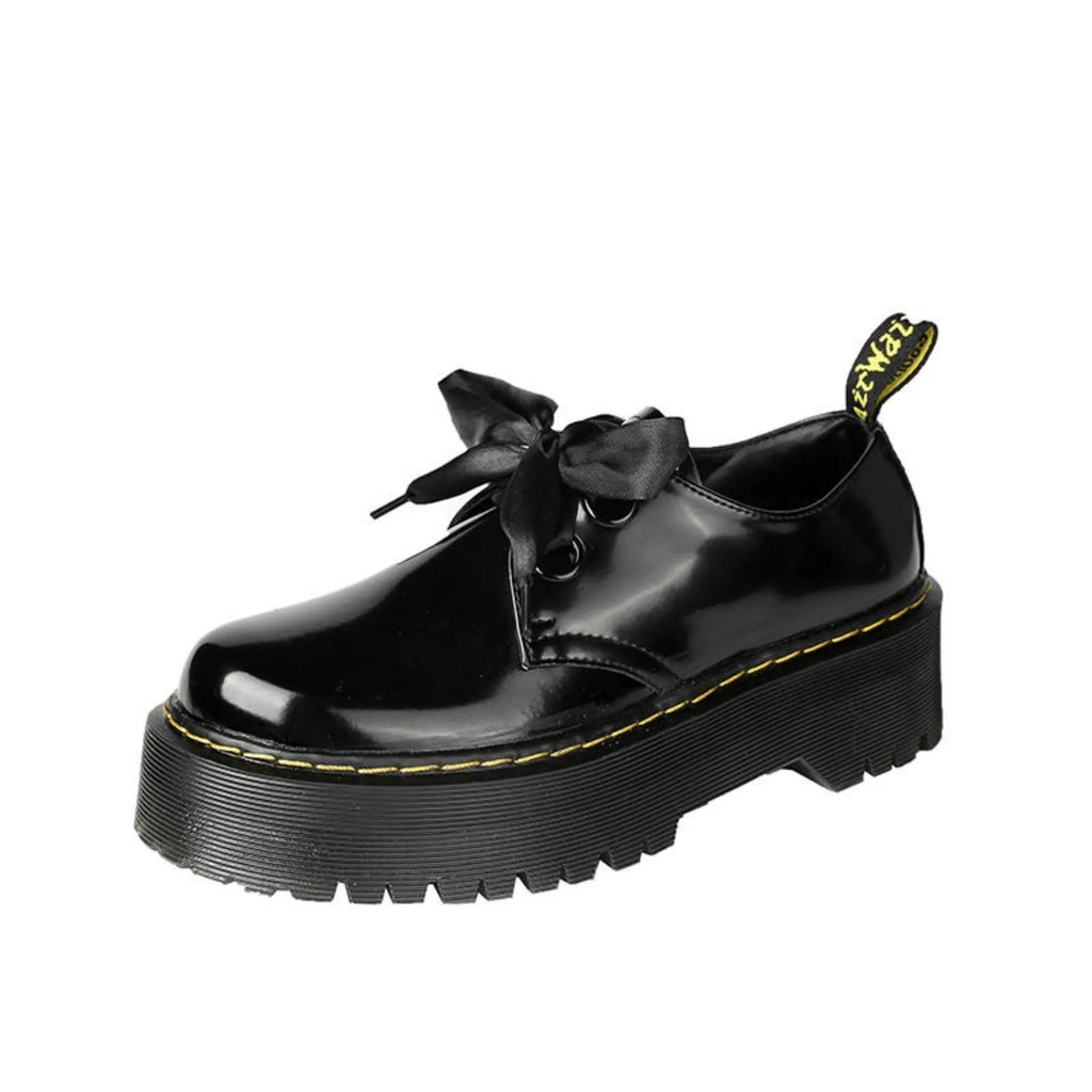 Women's thick-soled leather shoes with lace-up closure and decorative ribbon detailing