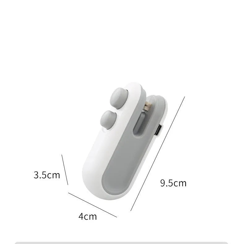 Handheld white vacuum sealer with cutter blade and magnetic back for bag sealing
