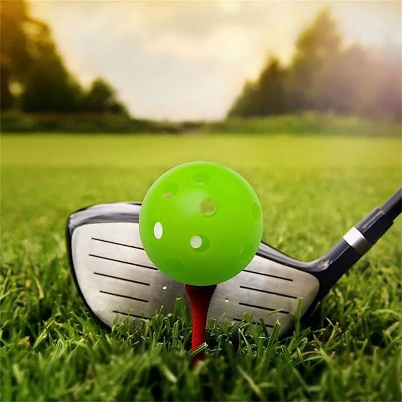 Multi-colour golf practice balls on 26-hole putting mat with net pocket packaging