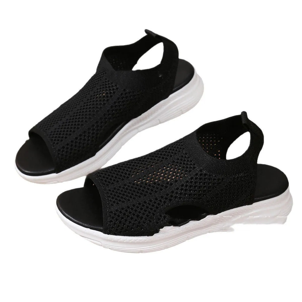Women's platform sports sandals in pink with mesh lining and a flat toe bracket design.