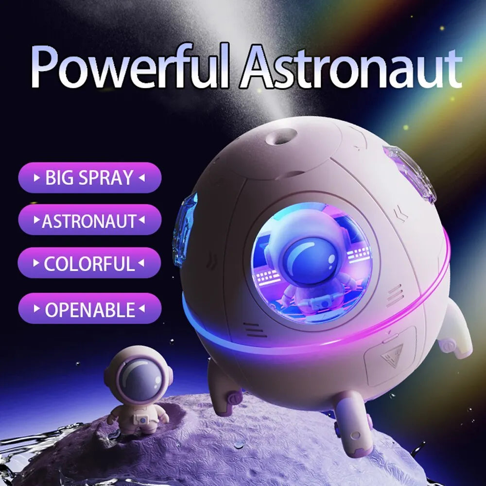 Purple astronaut-shaped USB desktop humidifier with LED lights on a desk