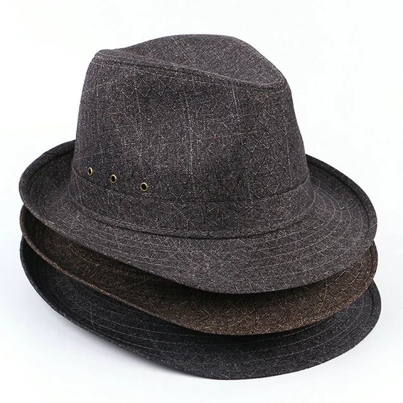 A classic fedora hat for men in thickened suit material, shown in a neutral colour on a stand.