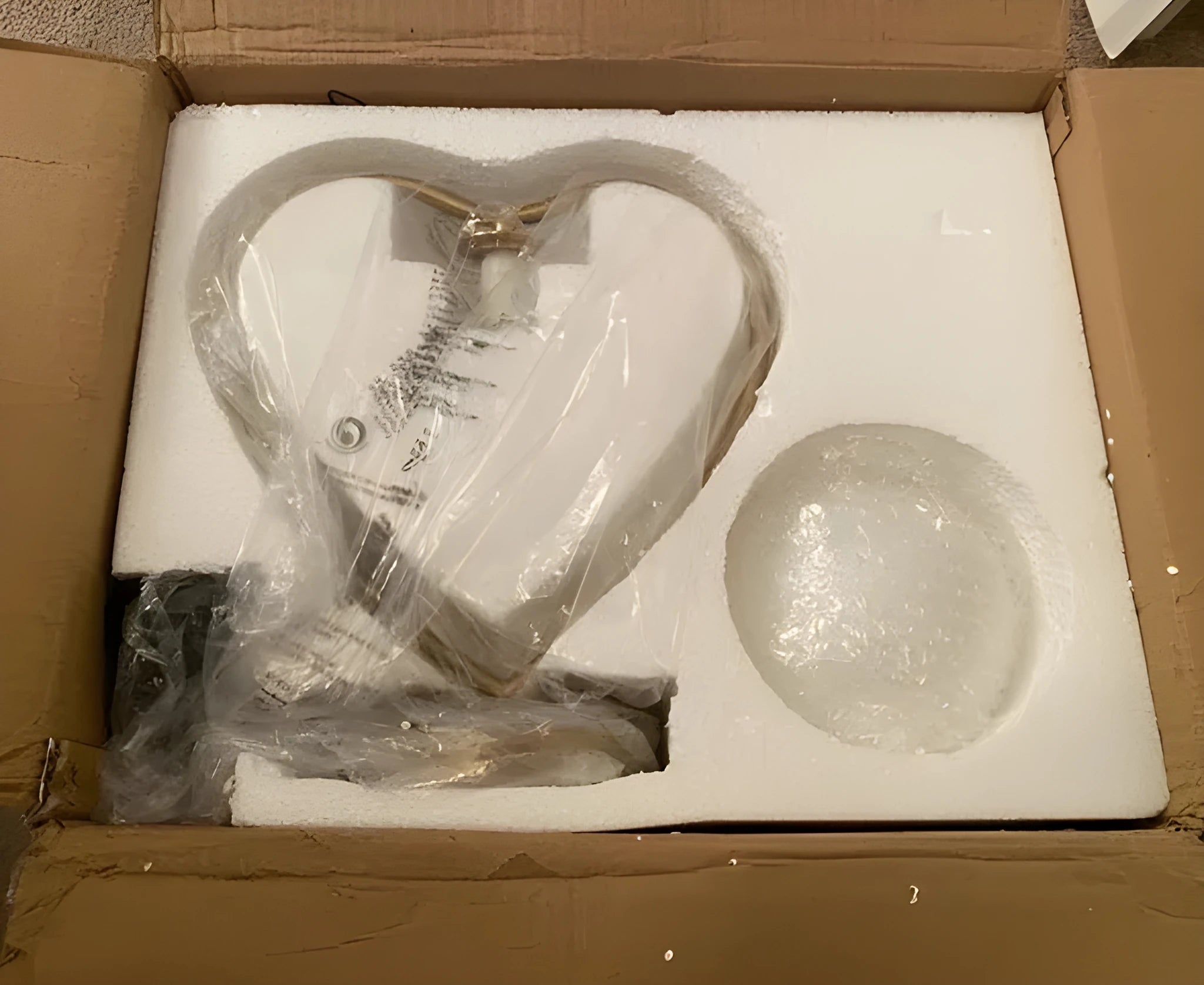White heart shaped bedside table lamp with warm LED light and USB charging port.