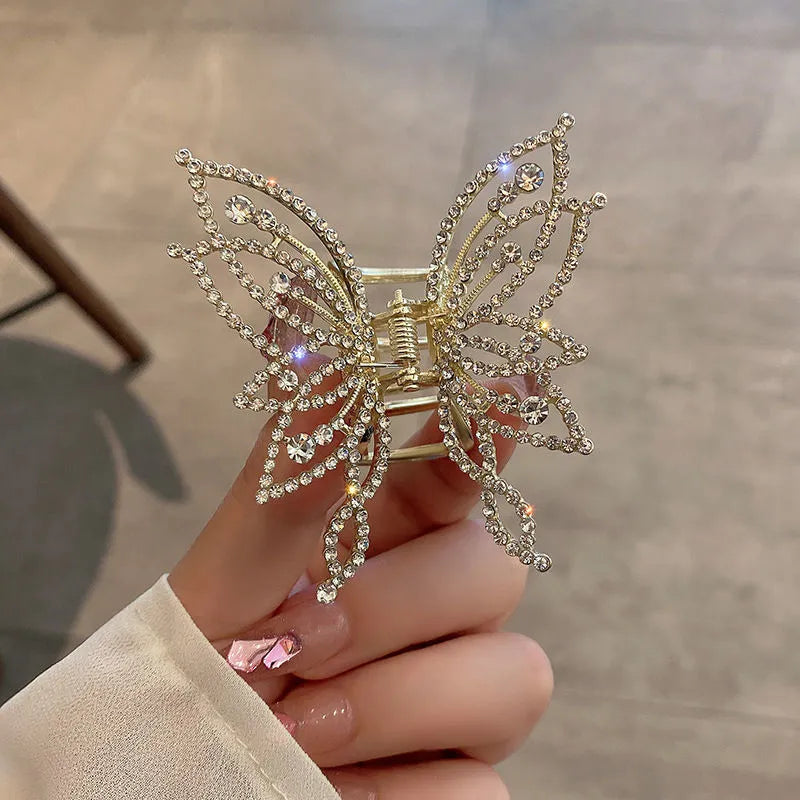 Butterfly-shaped alloy hair clip barrette for women, available in rhinestone and pearl styles.
