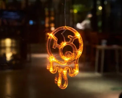 Halloween battery-powered LED window lights with suction cups showing spider, pumpkin and ghost designs