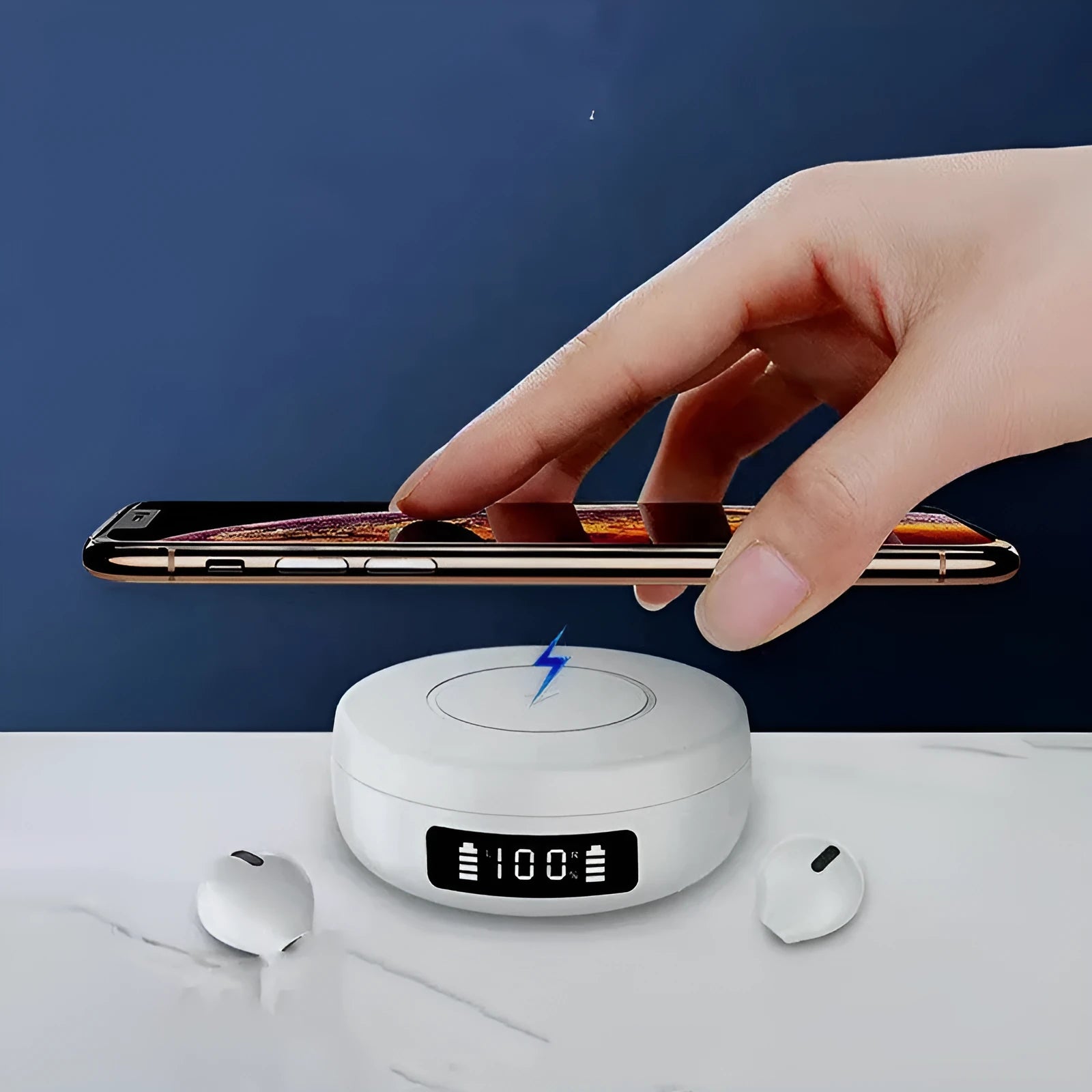 Mini black semi-in-ear wireless headphones placed inside their white wireless charging case, shown open.