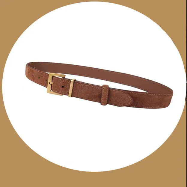 Women's black leather belt with quadrilateral silver alloy pin buckle on wooden surface