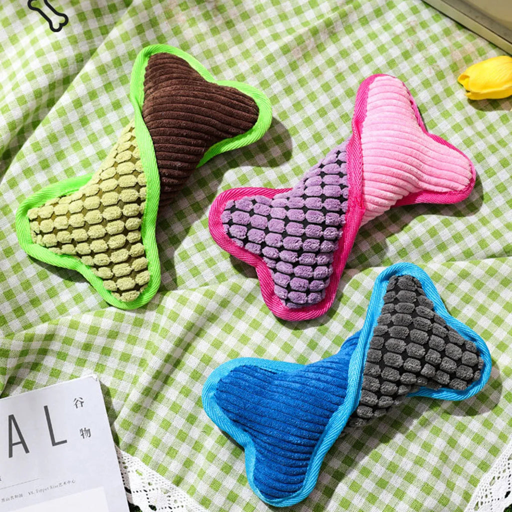 Blue teddy dog toy with a squeaker bone model, showing soft plush and corn fleece lining.