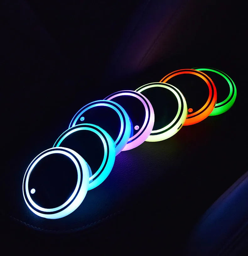 Colourful LED light-up coaster for car cup holders showing seven colour options and USB charging cable