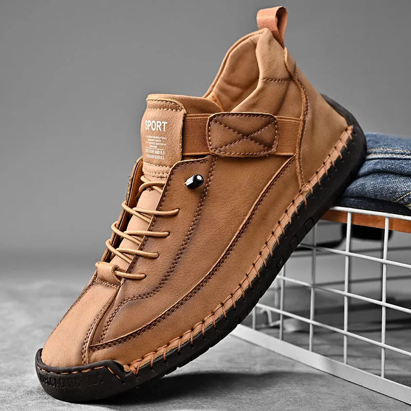 Men's mid-calf black Martin boot with stitching detail and elastic side band, flat rubber sole.