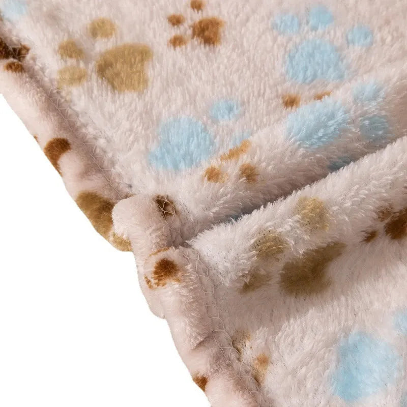 Blue cartoon dog print double-sided flannel pet blanket laid flat.
