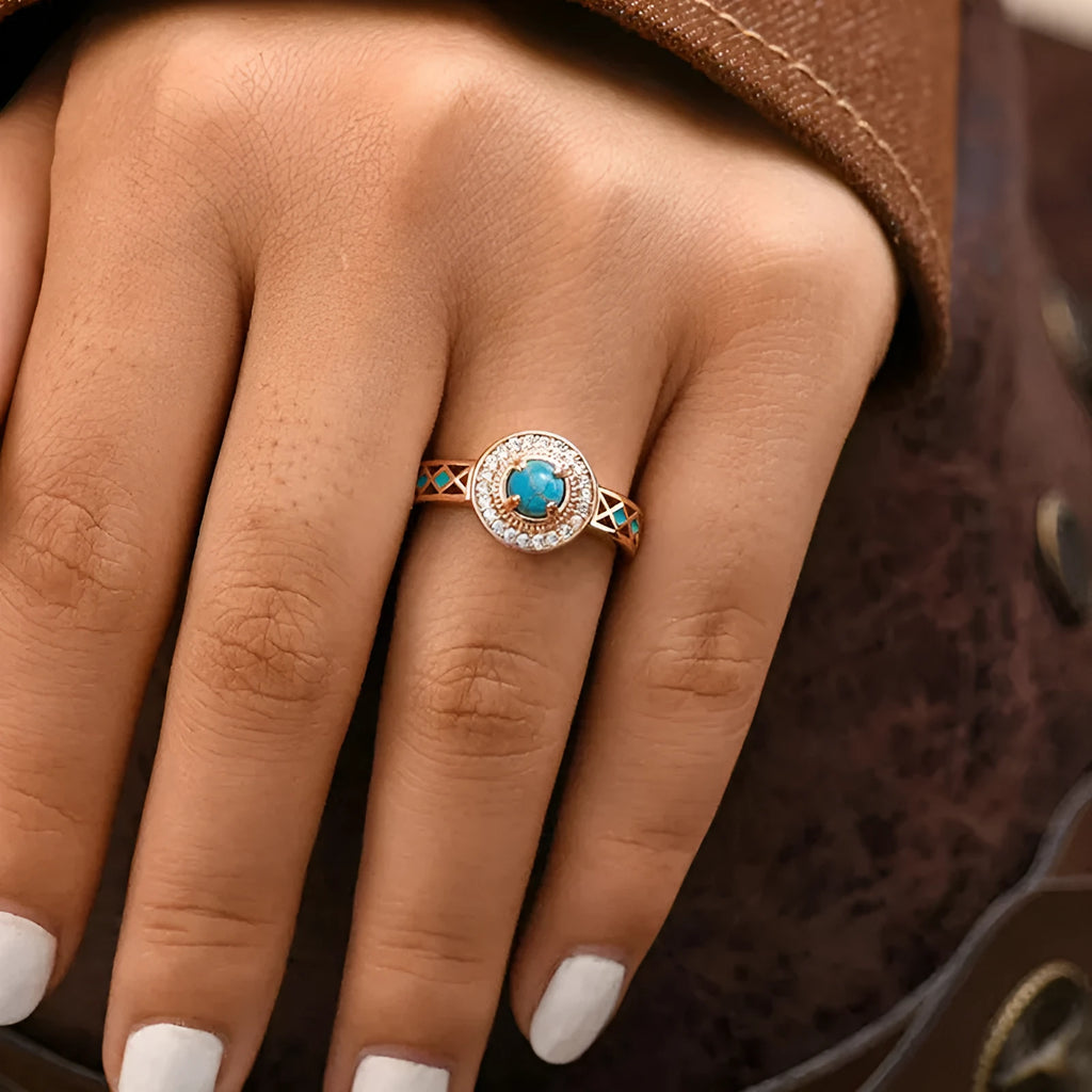 Women's rose gold copper ring with turquoise stone and geometric zircon inlay design.