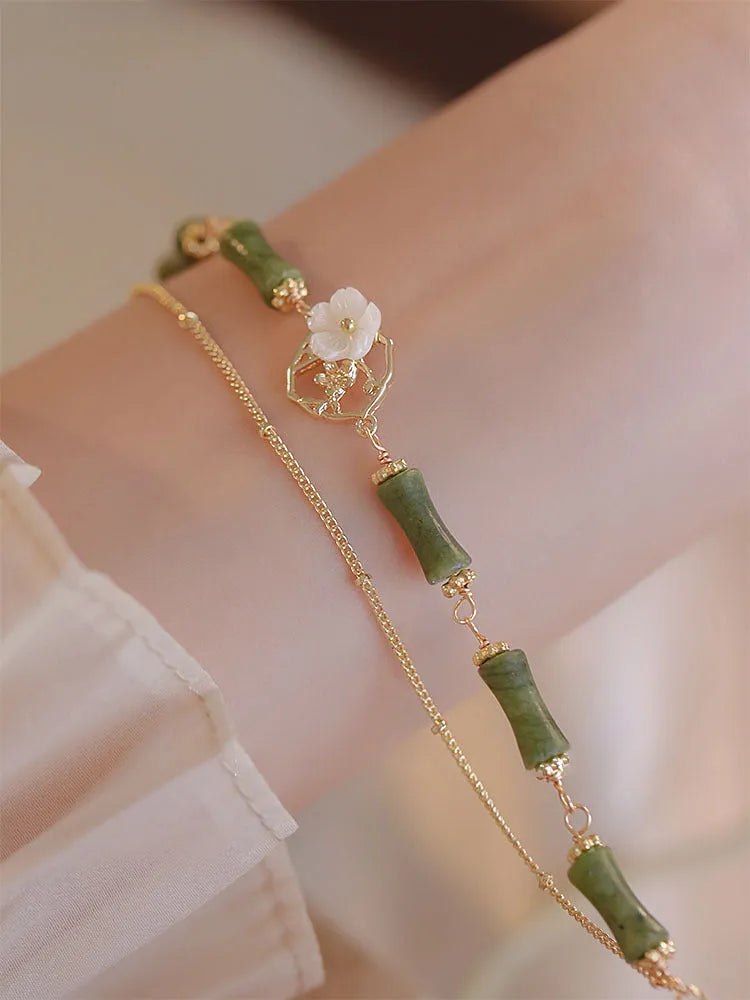 Handmade natural olivine stone bracelet with double layer twin bells of Ireland design.