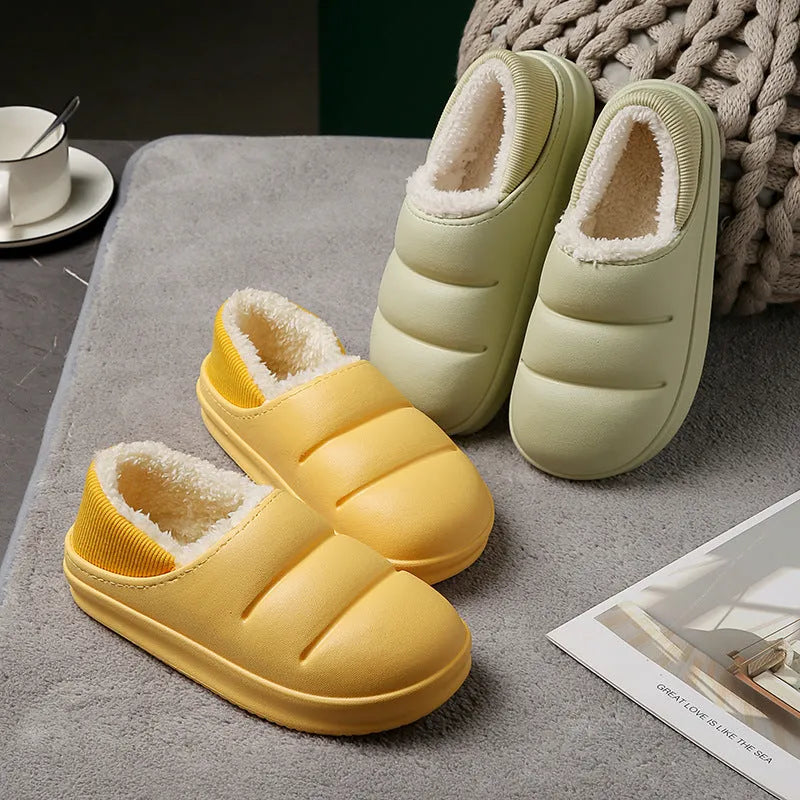 A pair of waterproof EVA couple slippers with a plush lining, shown in a choice of colours like green, pink, or grey.