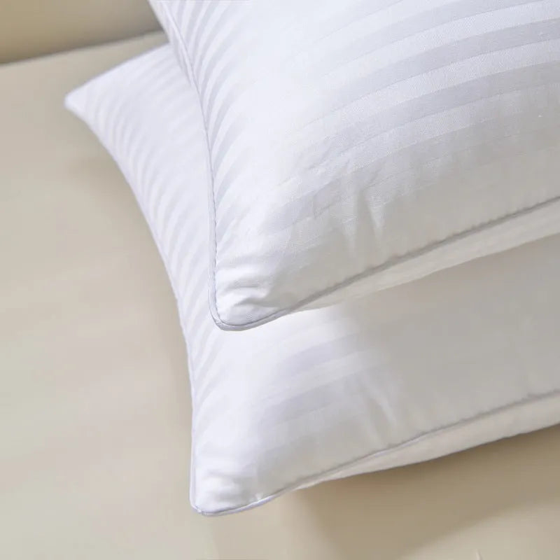 White cotton satin stripe pillow with feather and cotton filling, shown in low, medium, and high loft options.