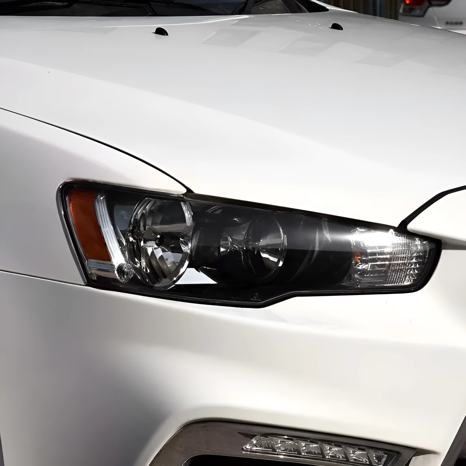 Transparent plastic headlight housing cover for car lighting replacement measuring 50x30x20mm
