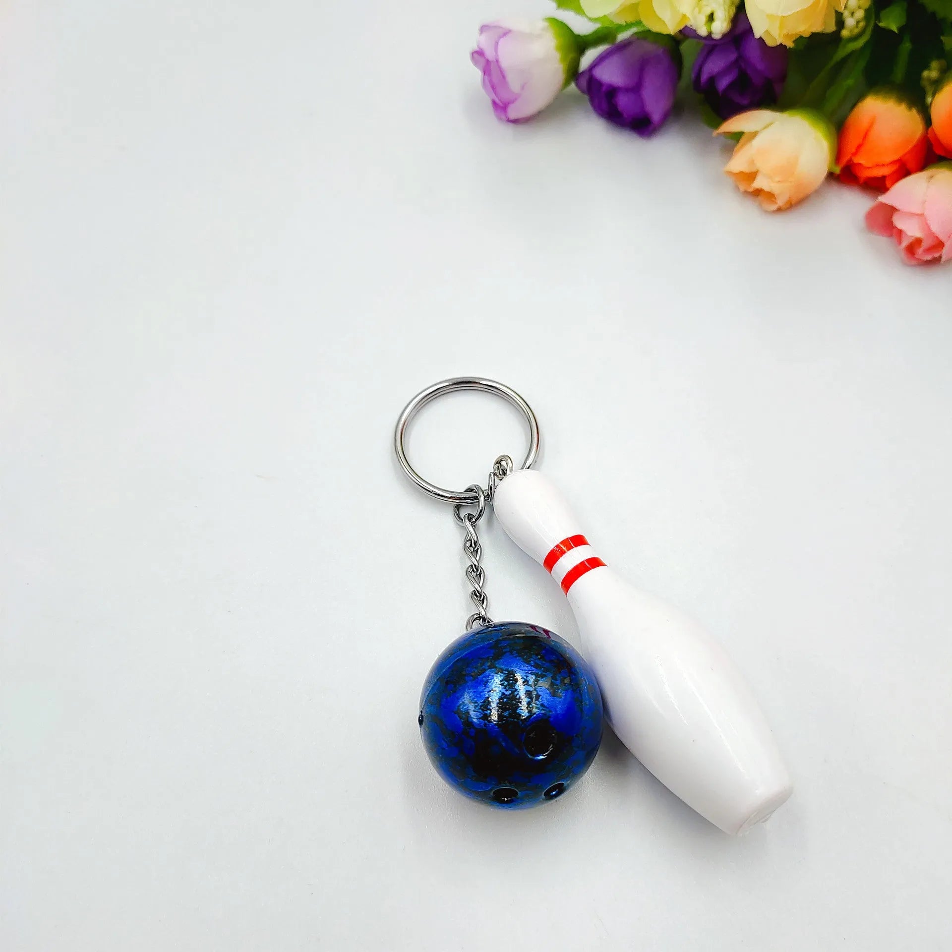 Mini bowling sports simulation keychain pendant in PVC metal showing colour options