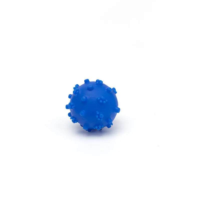 Set of four brightly coloured spiked squeaky dog balls on a blue background