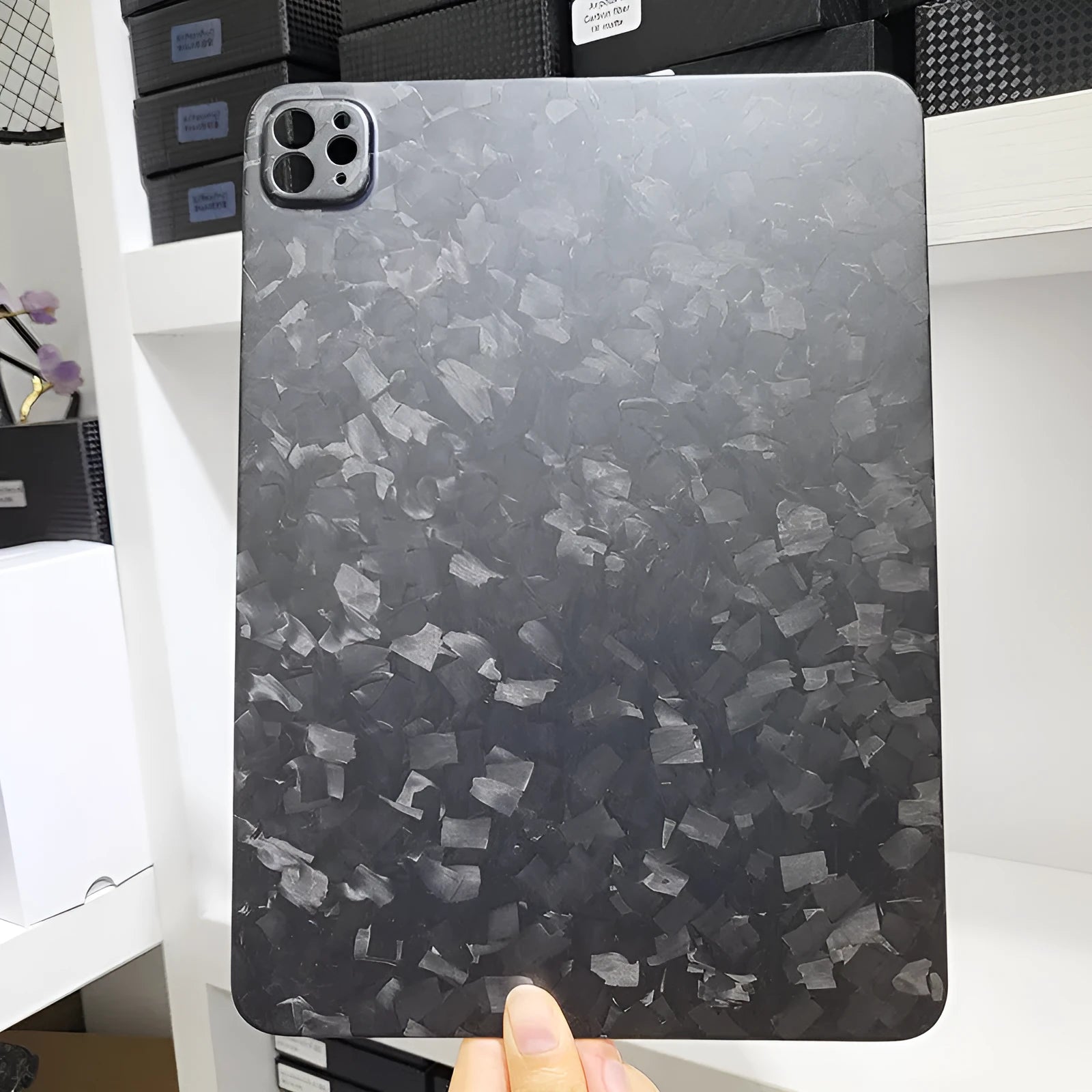 Carbon fibre protective cover for iPad Pro 11 showing embossed plaid texture