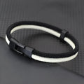 Handmade woven hand strap in black Milan rope alloy showing woven texture and simple design