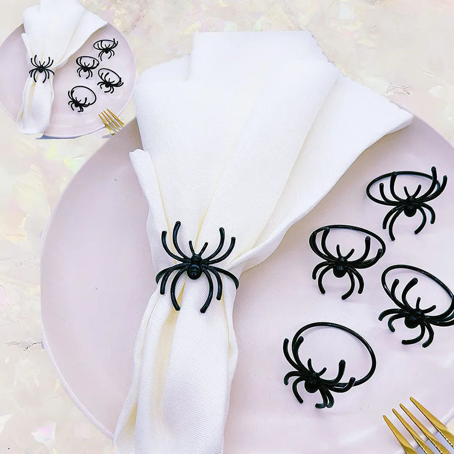 Six black spider-design alloy napkin rings for Halloween table settings